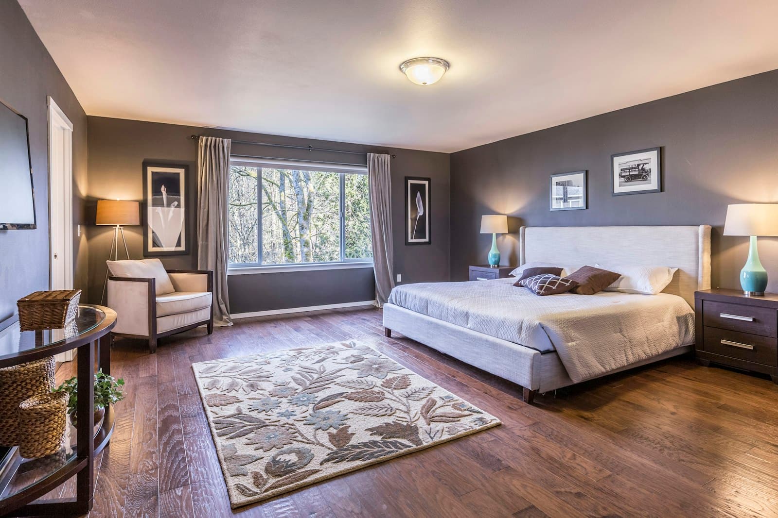 A neatly made bed with white linens in a bedroom