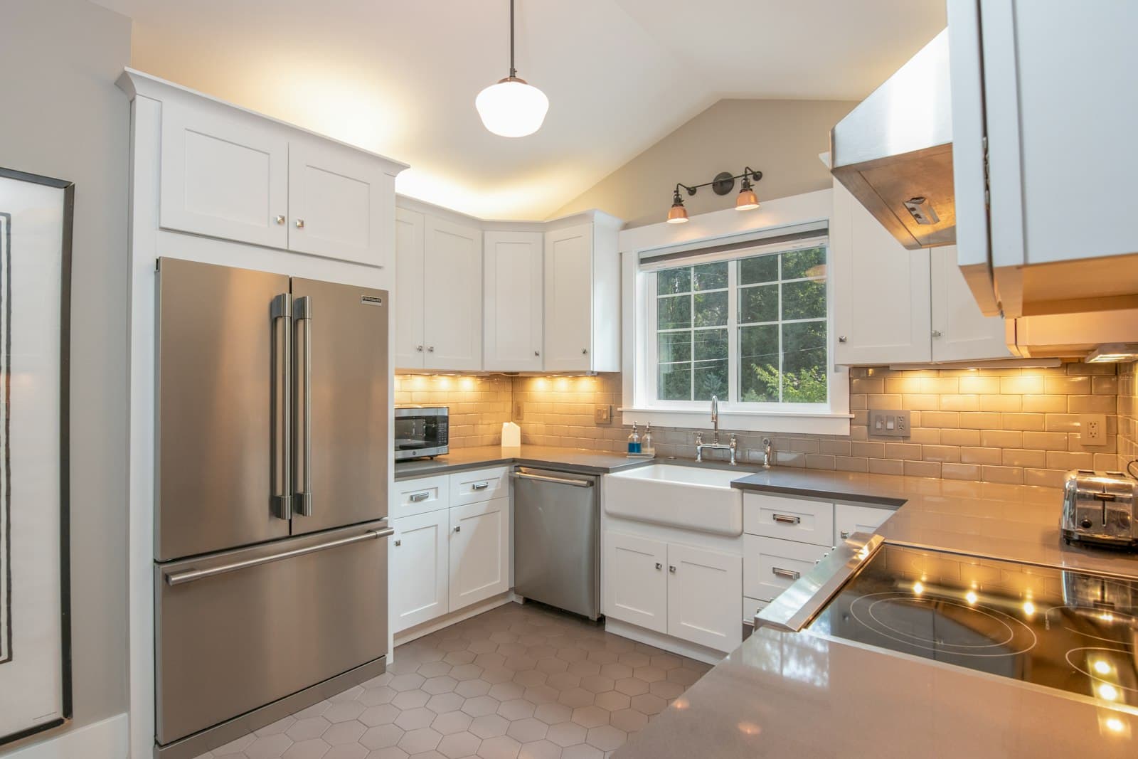 A modern kitchen with a stainless steel refrigerator